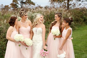 bride and bridesmaids standing outside