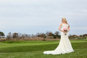 bride posing on golf green