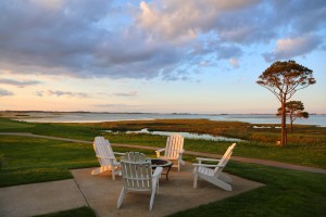 chairs and firepit outside by bay